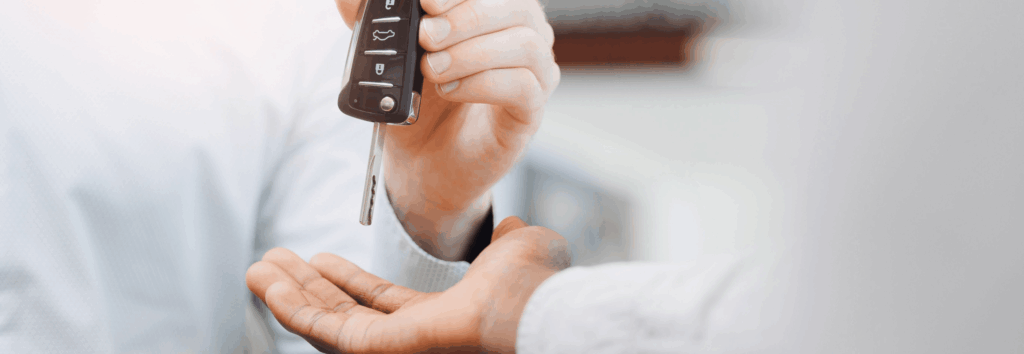 Man handing keys over