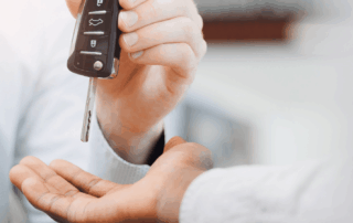 Man handing keys over
